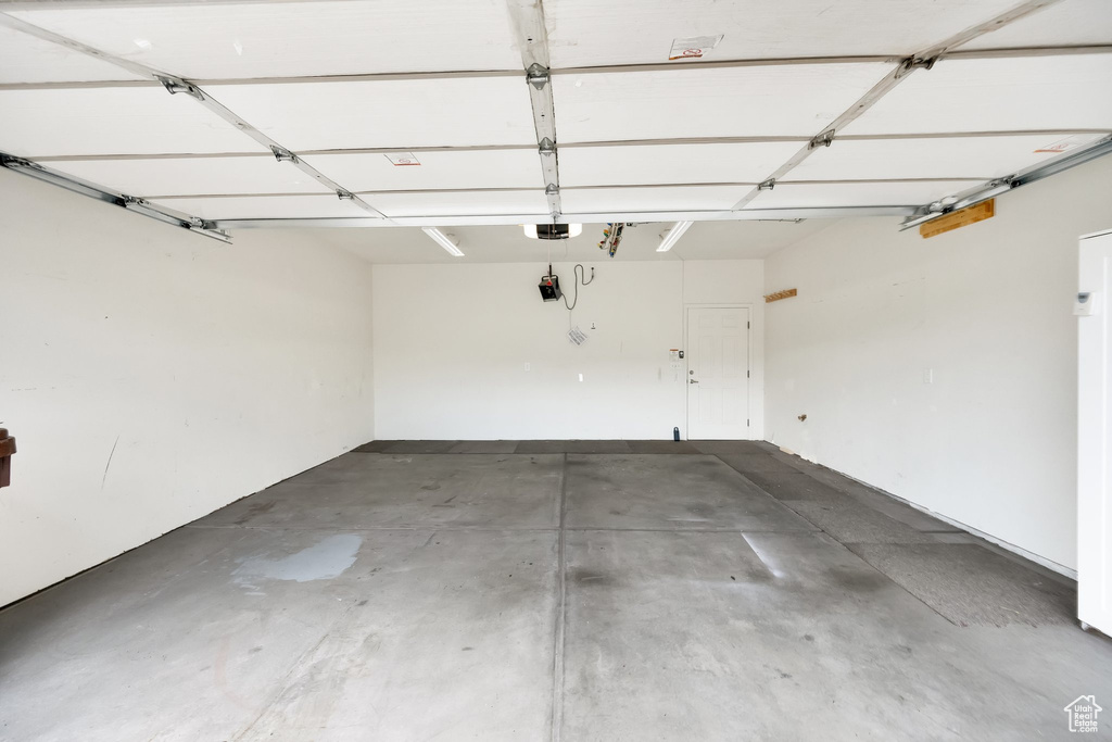 Garage featuring a garage door opener