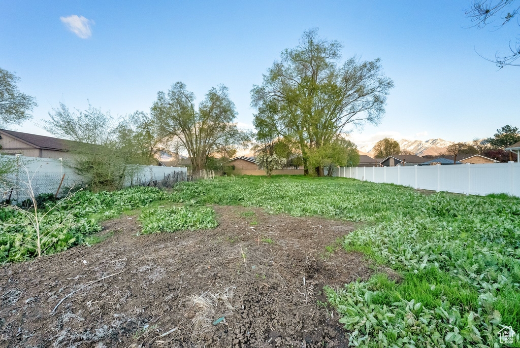 View of yard featuring fence