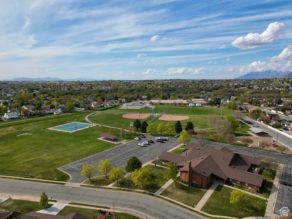 Birds eye view of property with a residential view and a mountain view