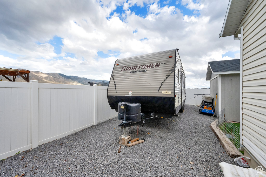 Exterior space with fence and a mountain view