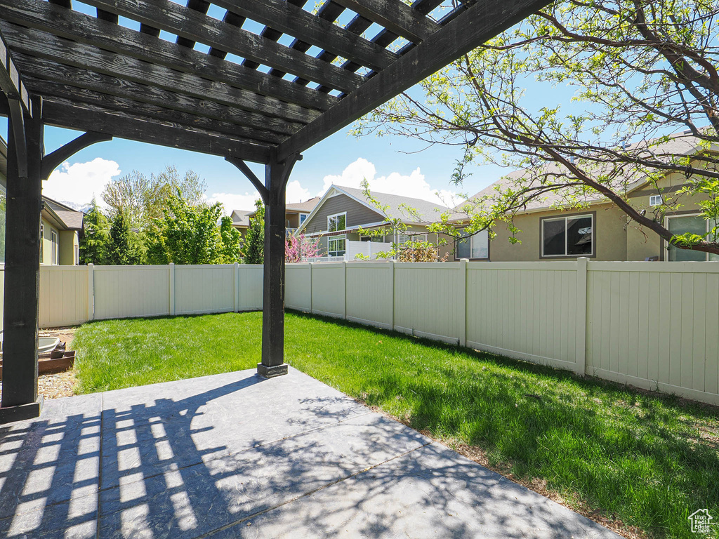 View of patio / terrace with a pergola and a fenced backyard