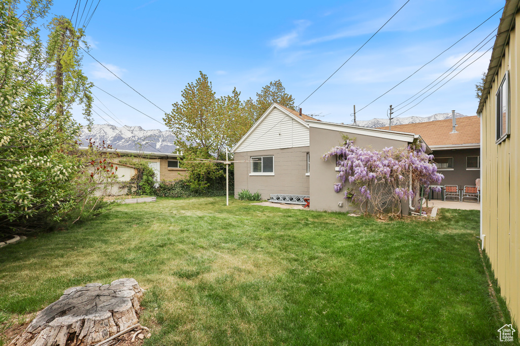 View of yard with a mountain view and a patio