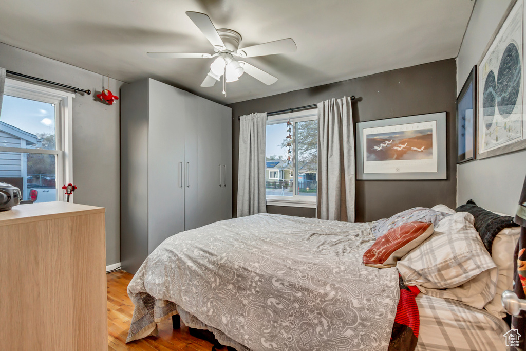 Bedroom featuring a ceiling fan and wood finished floors