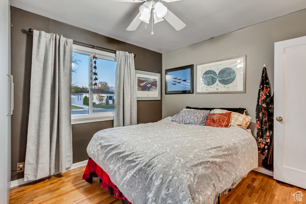 Bedroom with ceiling fan and wood finished floors