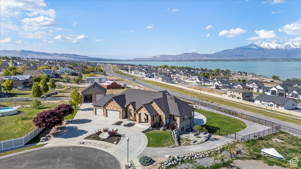 Birds eye view of property featuring a residential view and a water and mountain view