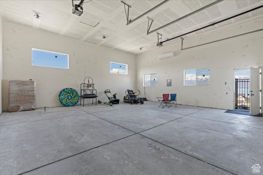 Garage featuring a garage door opener