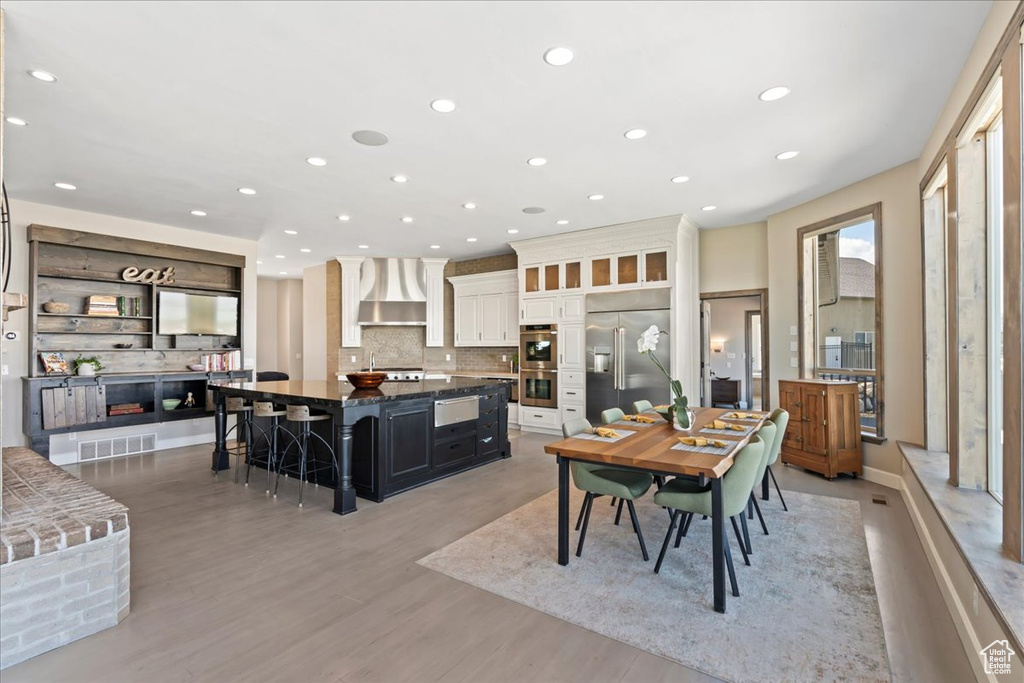 Dining room featuring recessed lighting, visible vents, and light wood finished floors