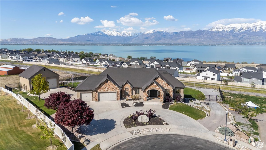 Birds eye view of property with a residential view and a water and mountain view