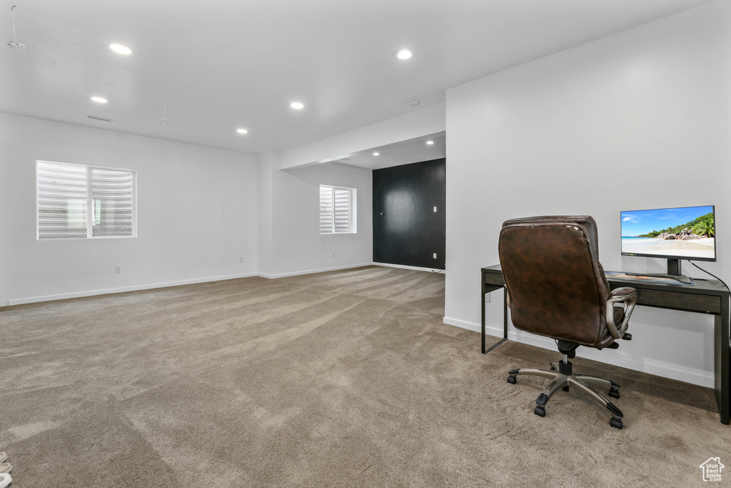 Carpeted office featuring baseboards and recessed lighting