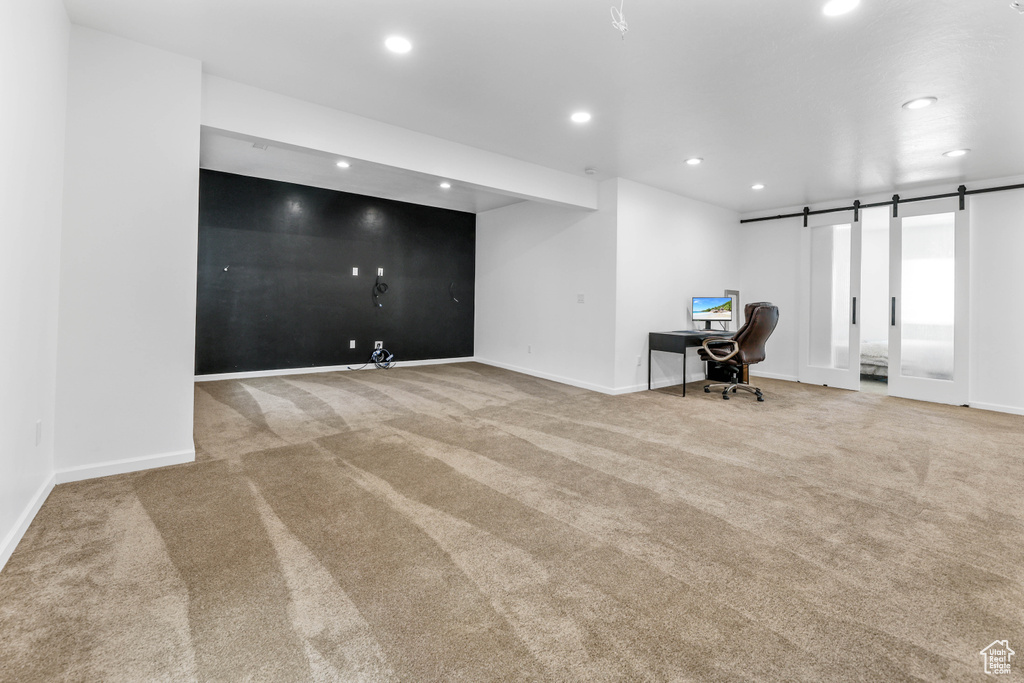 Unfurnished office featuring recessed lighting, carpet flooring, and baseboards