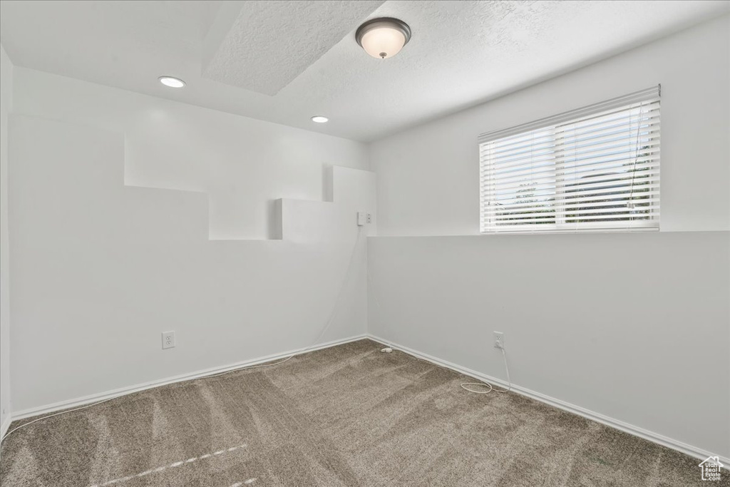 Unfurnished room with baseboards, carpet flooring, a textured ceiling, and recessed lighting