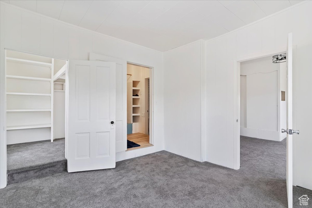 Unfurnished bedroom featuring carpet floors