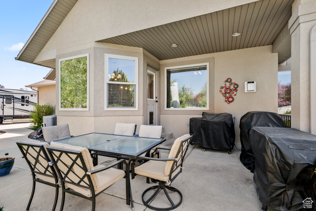 View of patio / terrace featuring outdoor dining space and a grill