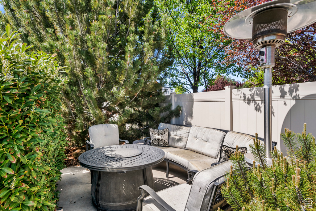 View of patio / terrace featuring fence and an outdoor living space