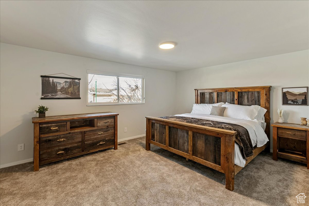 Carpeted bedroom with baseboards