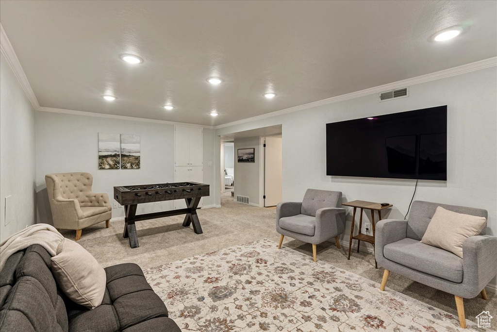 Living area with crown molding, recessed lighting, and visible vents