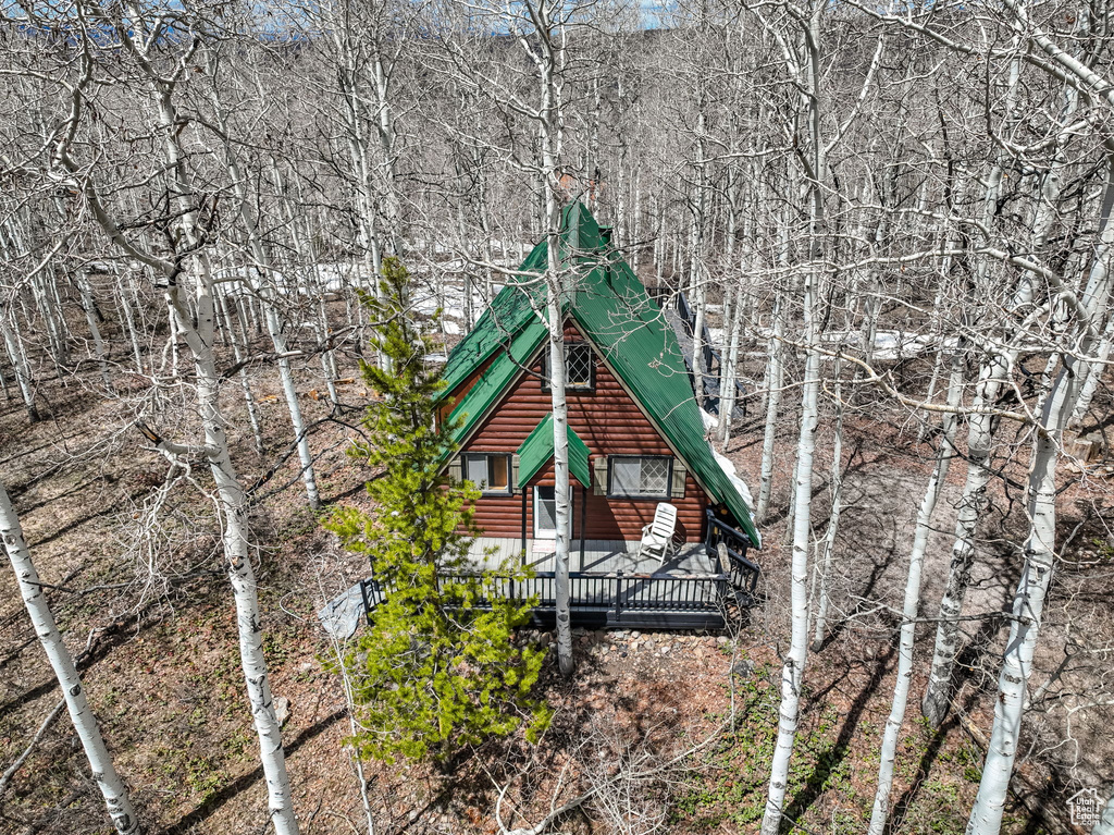 Exterior space with faux log siding