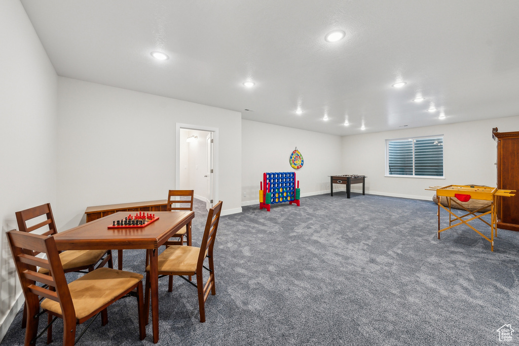 Game room featuring dark carpet, baseboards, and recessed lighting