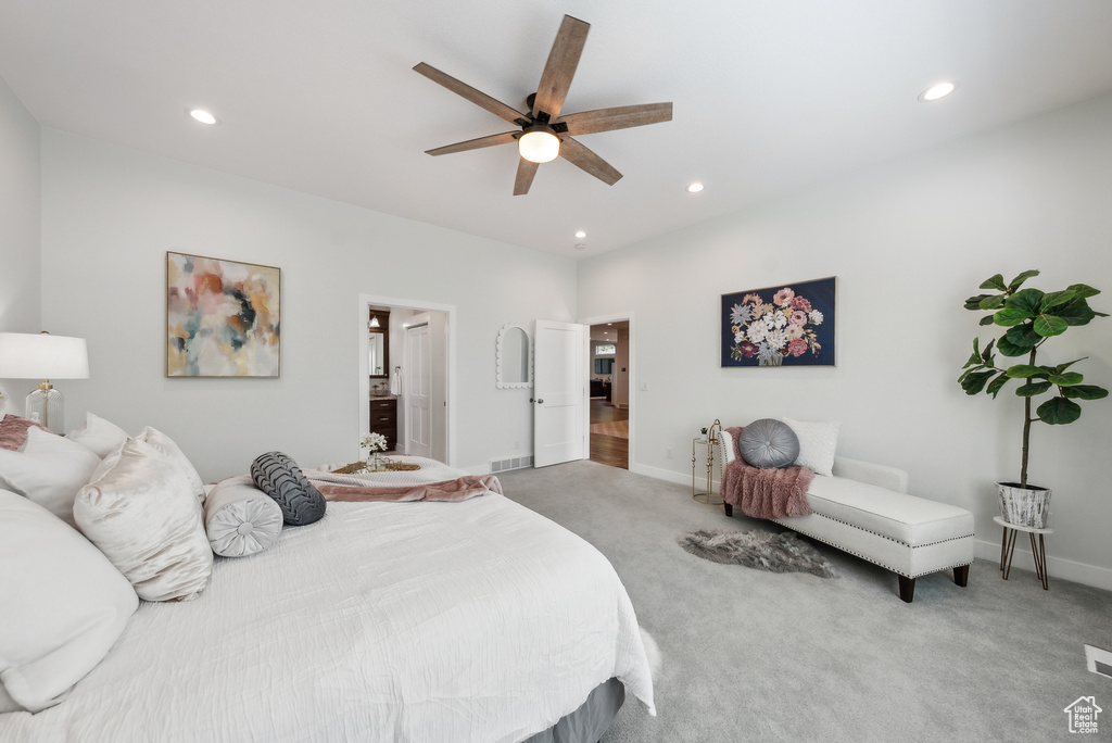 Carpeted bedroom featuring ensuite bath, ceiling fan, baseboards, and recessed lighting