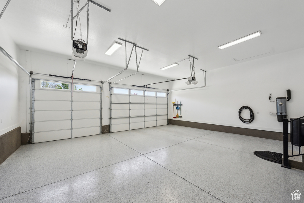 Garage featuring a garage door opener