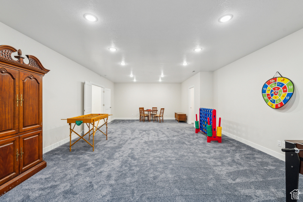 Game room with recessed lighting, baseboards, and dark carpet