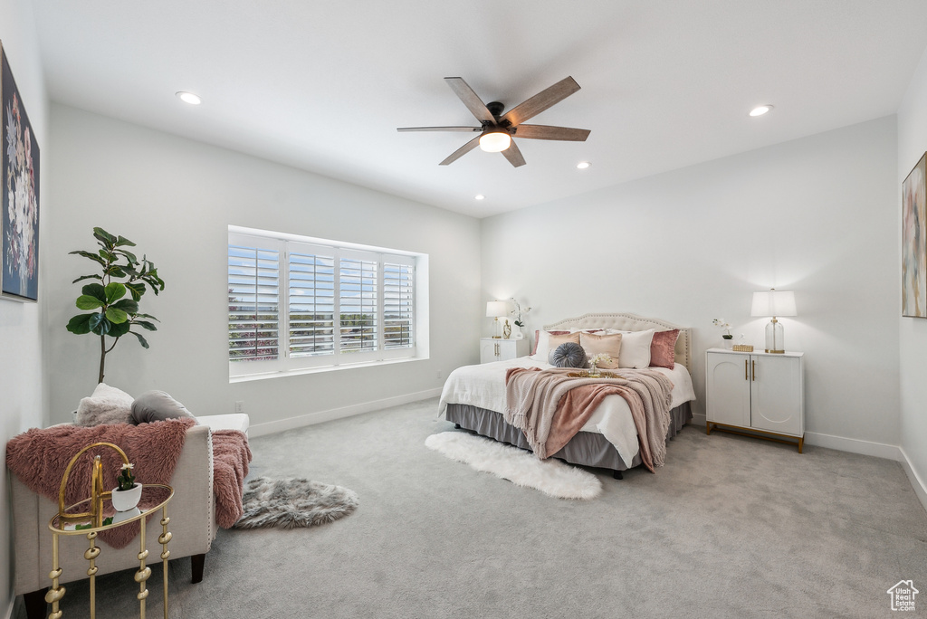Carpeted bedroom with baseboards, recessed lighting, and a ceiling fan