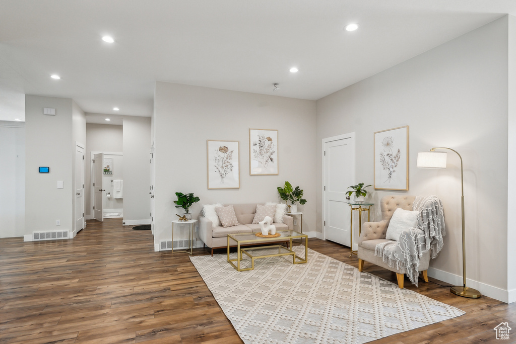 Living area featuring recessed lighting, visible vents, and wood finished floors
