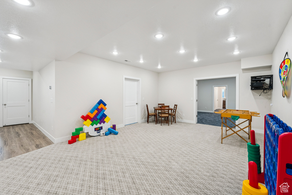Rec room featuring baseboards and recessed lighting
