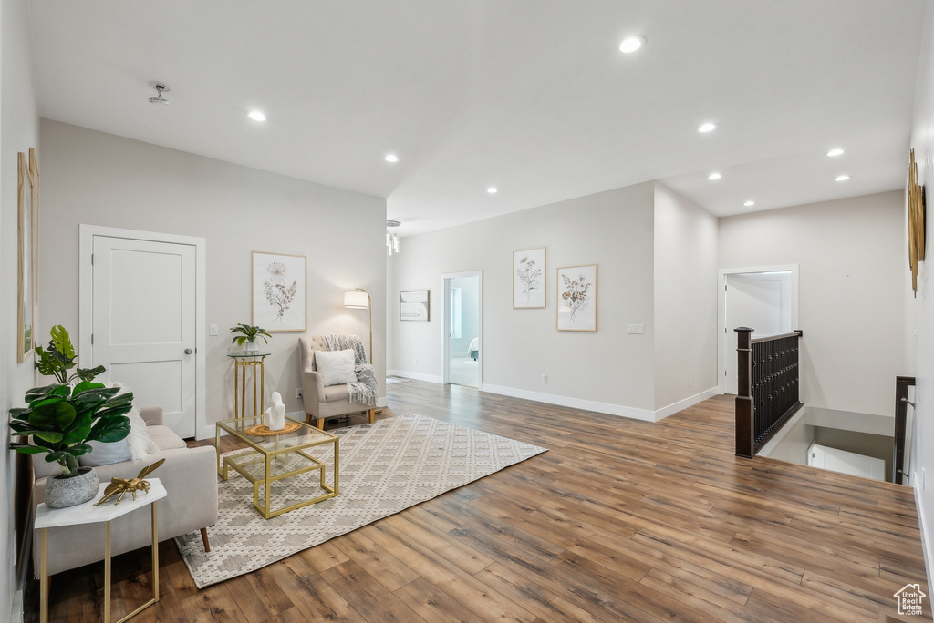 Sitting room featuring baseboards, recessed lighting, and wood finished floors