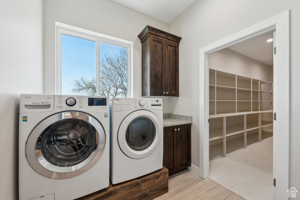 Laundry room featuring cabinet space and washing machine and dryer