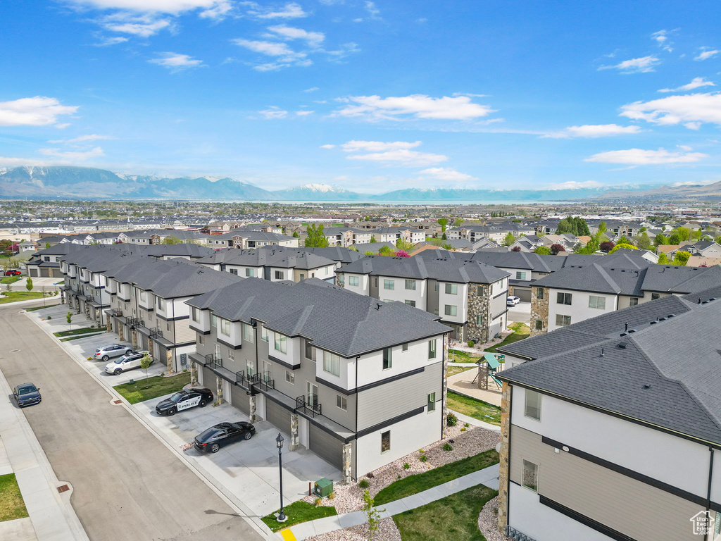 Birds eye view of property with a residential view and a mountain view