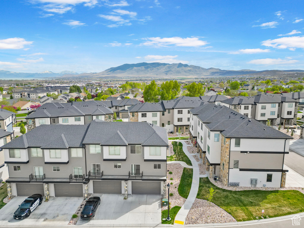 Birds eye view of property with a residential view and a mountain view