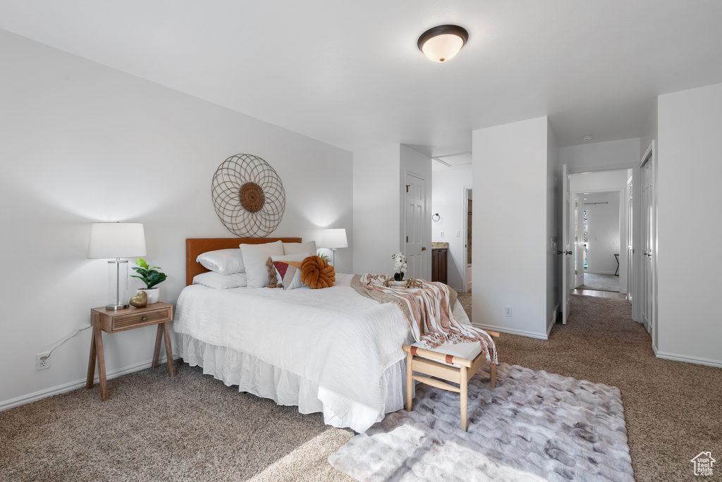 Bedroom with carpet floors and baseboards