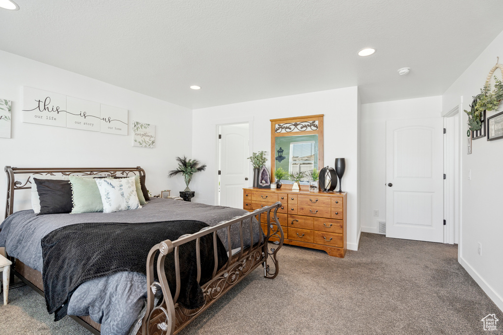 Bedroom with recessed lighting, baseboards, and carpet