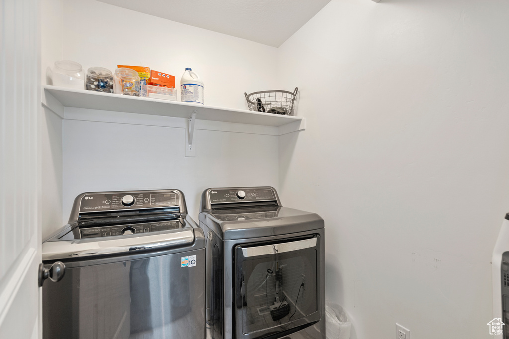 Laundry room with laundry area and washing machine and clothes dryer