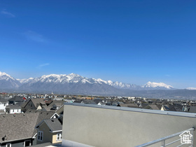 Mountain view featuring nearby suburban area