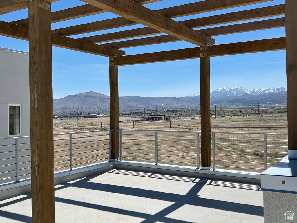 Exterior space featuring a mountain view, a rural view, and fence