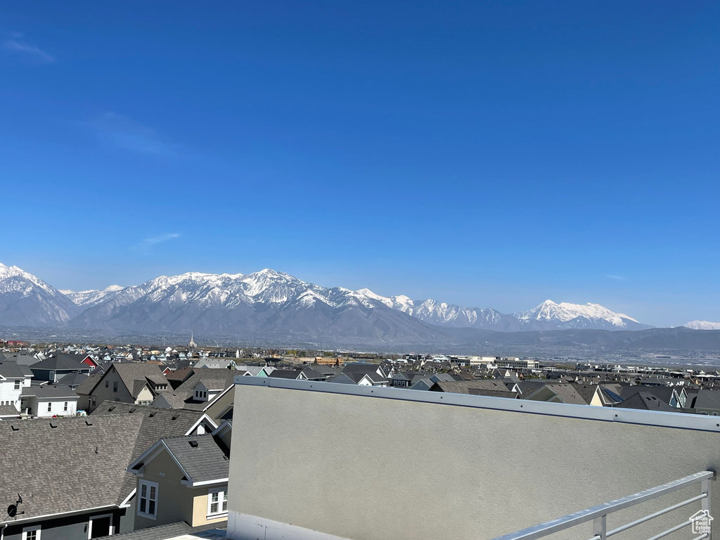 Property view of mountains with a residential view