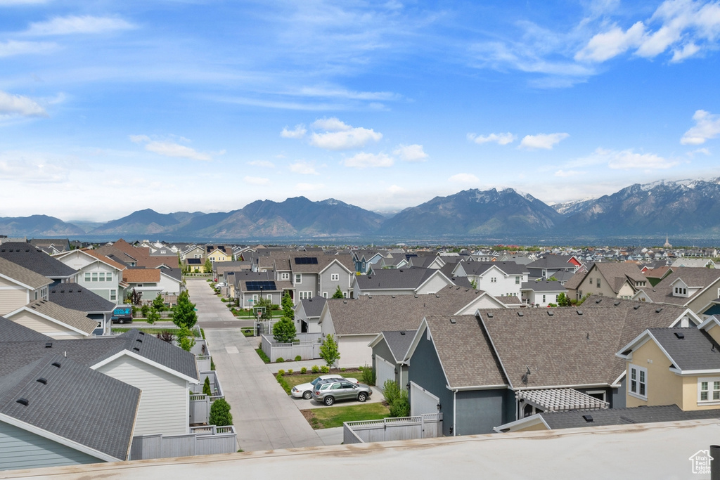 View of mountain backdrop featuring nearby suburban area
