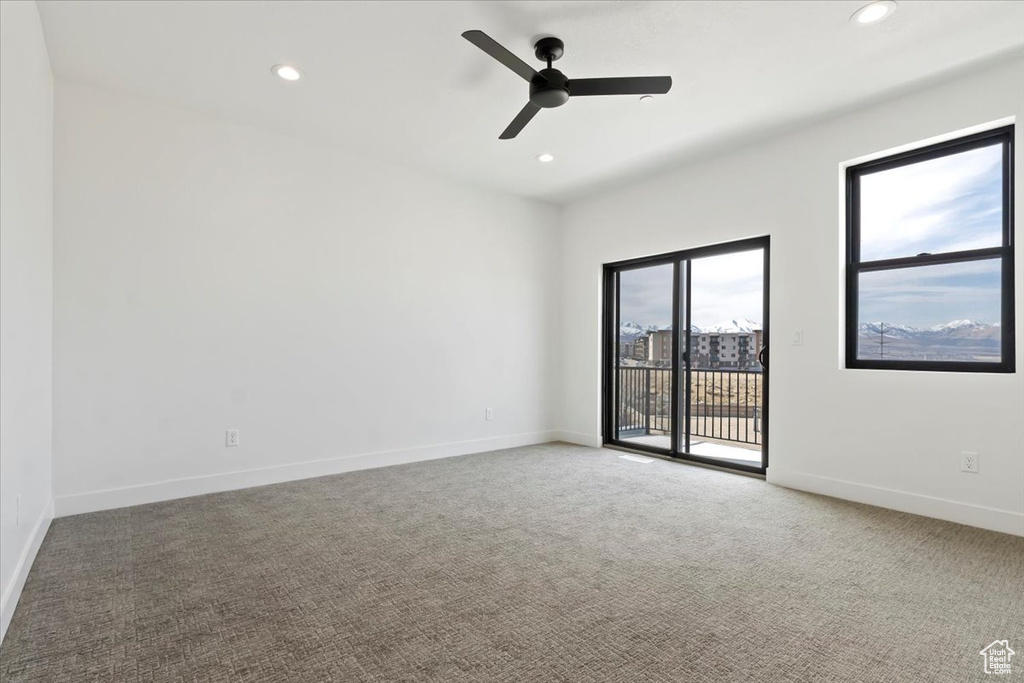 Empty room with recessed lighting, baseboards, and carpet