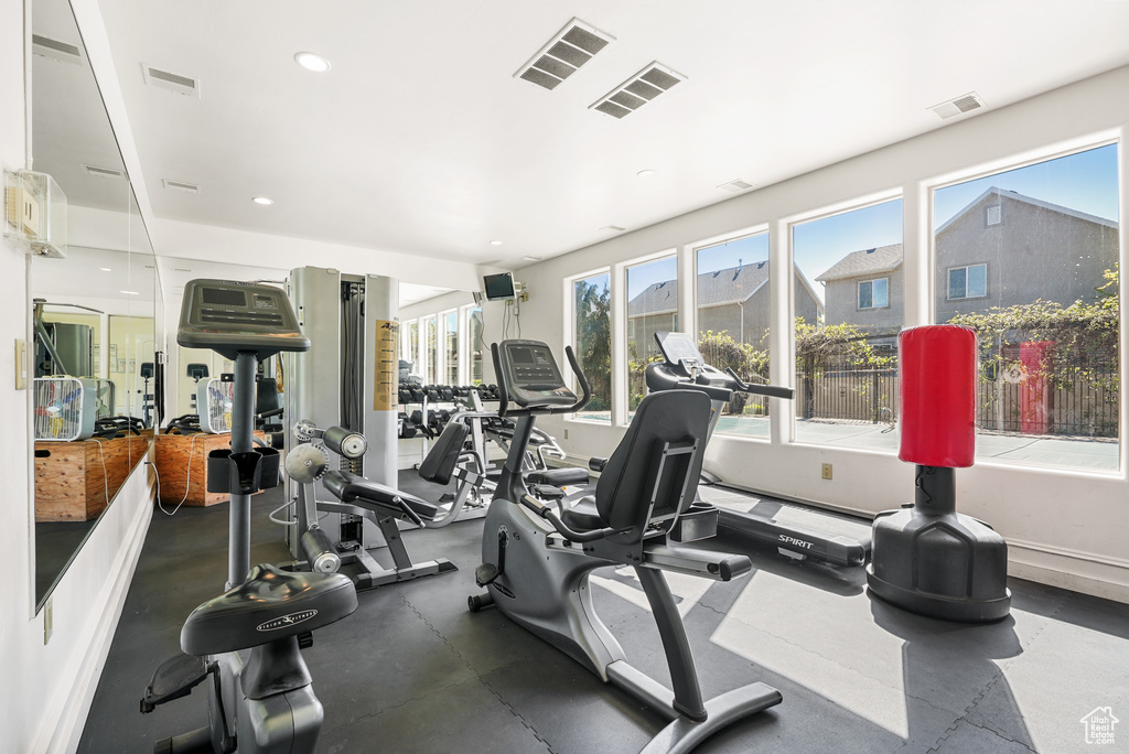 Exercise room with recessed lighting and visible vents