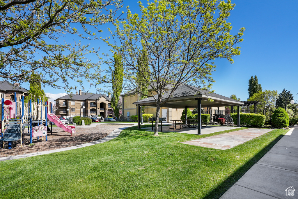 View of property\'s community featuring a lawn, a gazebo, and playground community