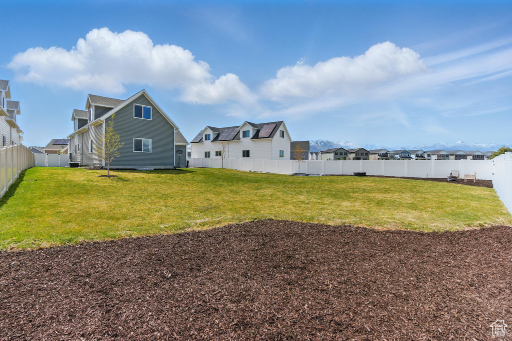 View of yard with a residential view and a fenced backyard
