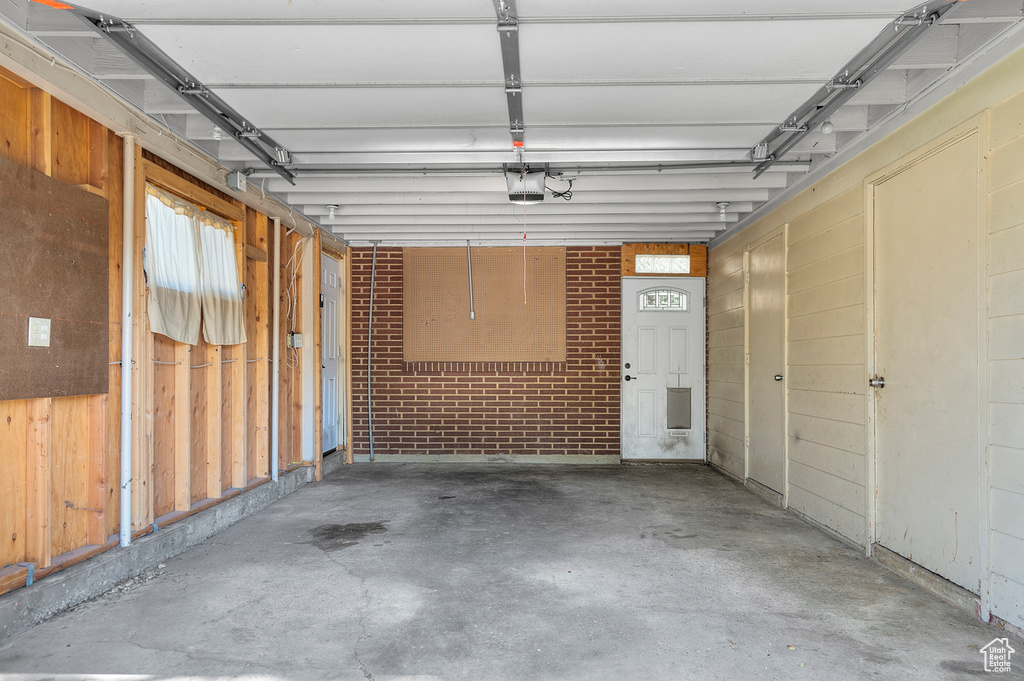 Garage featuring a garage door opener