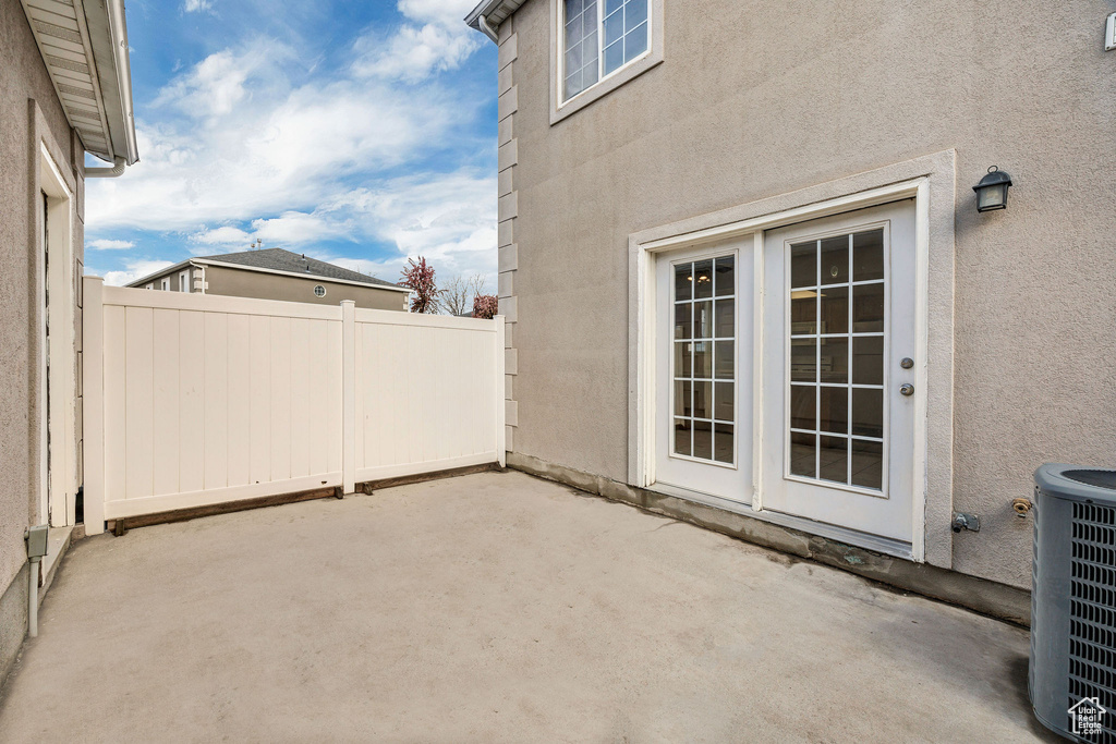 View of patio / terrace with central air condition unit and fence
