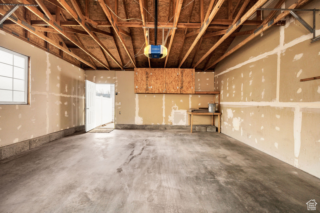 Garage featuring a garage door opener