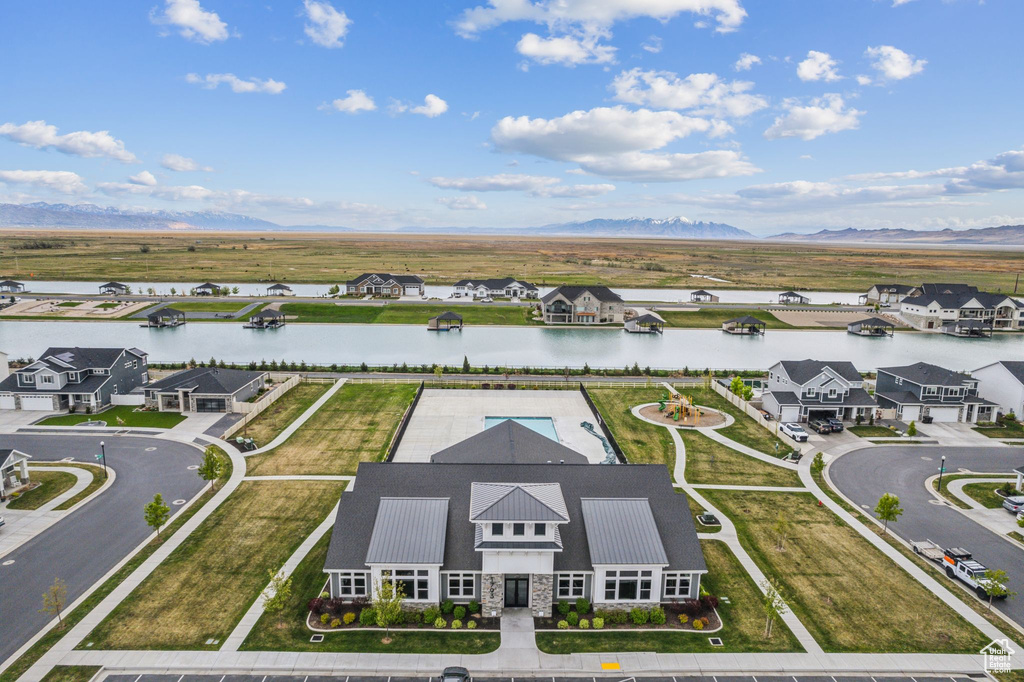 Aerial view featuring a water and mountain view and a residential view