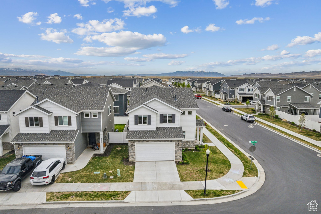 Drone / aerial view with a residential view and a mountain view