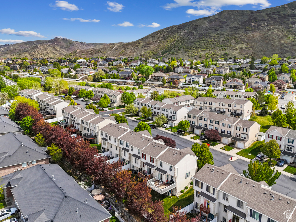 Birds eye view of property featuring a mountain view and a residential view