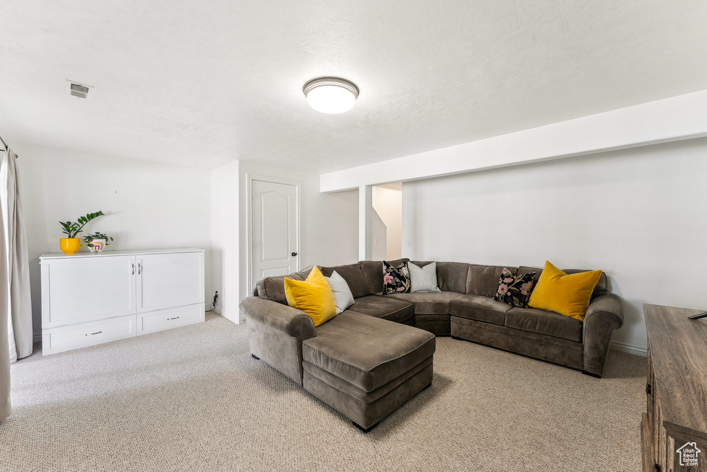 Living room featuring carpet floors and visible vents